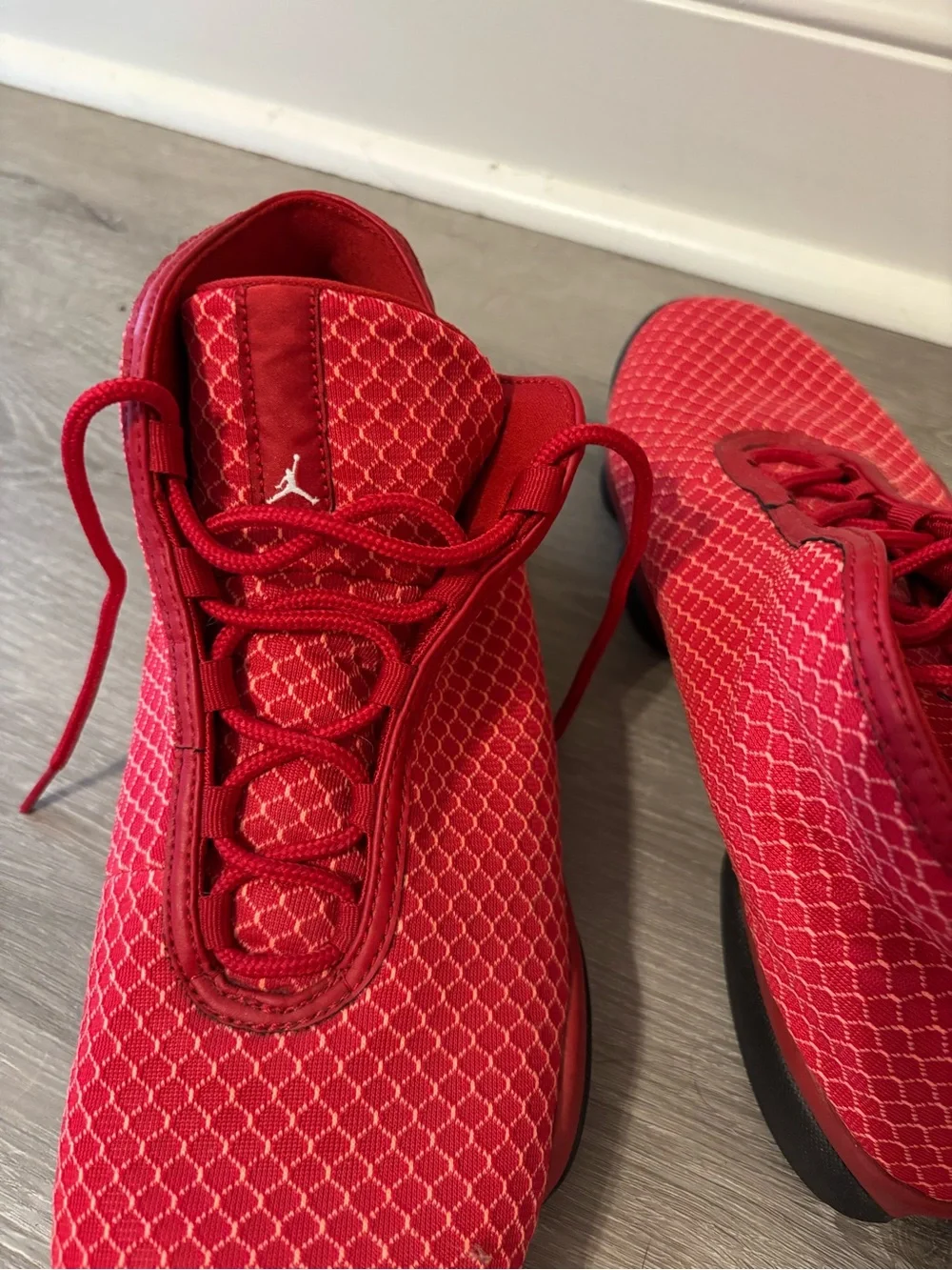 Men’s red high top Jordan sneakers